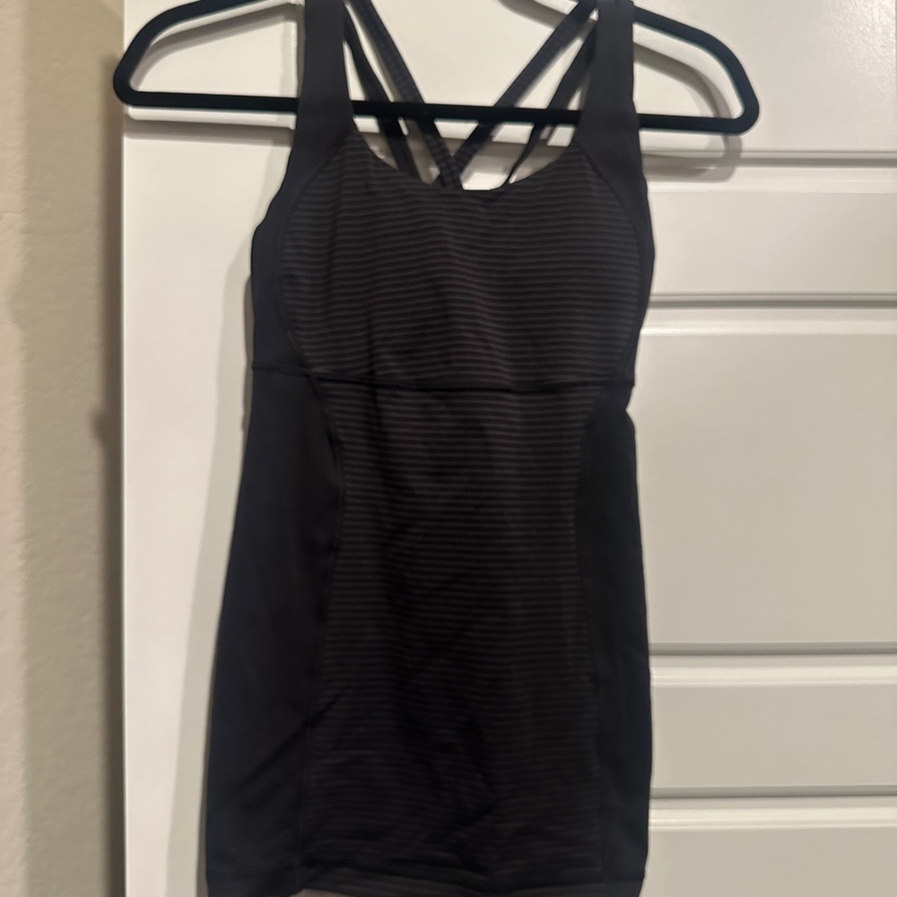 Lululemon fitted tank top. No tags but it is a size 6. Excellent condition.